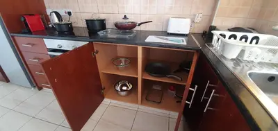 a kitchen with a counter and a sink and a counter top at Vasilas Holiday Apartment #2 in Larnaka