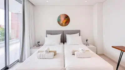 a bedroom with a bed with towels on it at Vivo Mare Beachfront Villas - Vista in Ayia Napa