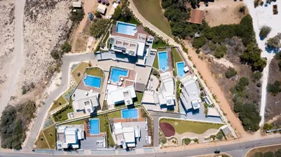 an aerial view of a house with blue at Sea Pearl Beachfront Villas - Breeze in Ayia Napa
