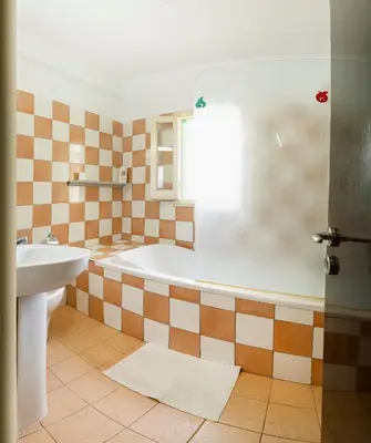 a bathroom with a tub and a sink at City center appartments in Nicosia