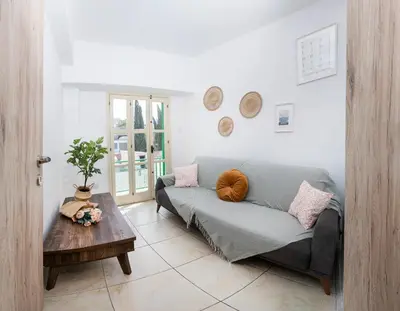 a living room with a couch and a table at City center appartments in Nicosia