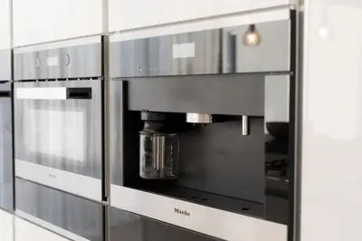 a kitchen with a coffee pot in a microwave at Sea Pearl Beachfront Villas - Anemone in Ayia Napa