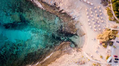an aerial view of a beach with a group of boats at Sea Pearl Beachfront Villas - Anemone in Ayia Napa