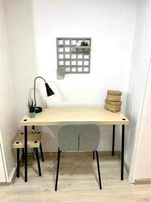 a desk with a chair and a lamp at Central Ground Floor Apartment in Nicosia