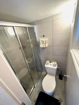 a small bathroom with a shower and a toilet at Central Comfort Studio in Larnaka