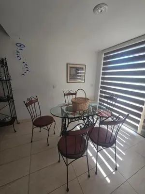 a dining room with a glass table and chairs at Lazuli Seafront Beach House Nr18 in Larnaka