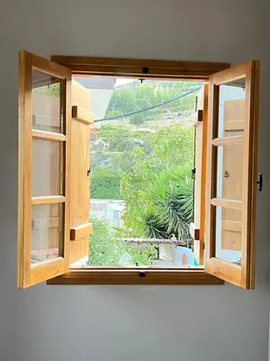 an open window in a room with a view at Eftis - Renovated Traditional House in Omodos