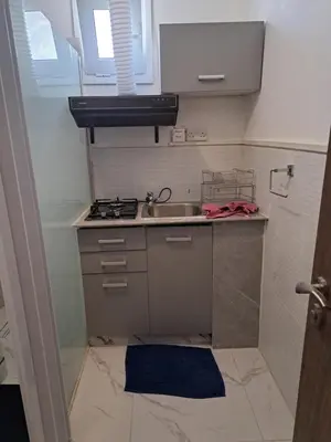 a small kitchen with a sink and a stove at Limassol Center Studios in Limassol