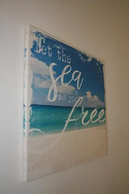 a picture of the ocean on a wall at Nissi Villa in Ayia Napa