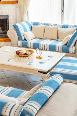 a living room with a couch and a coffee table at Villa Elliana by Ezoria Villas in Protaras