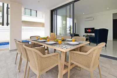 a dining room with a table and chairs at Villa Amity in Protaras