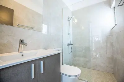 a bathroom with a toilet and a sink and a shower at Olivine Pearl OL21 in Protaras
