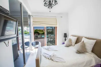 a bedroom with a bed with a bow on it at Villa Nyx in Protaras
