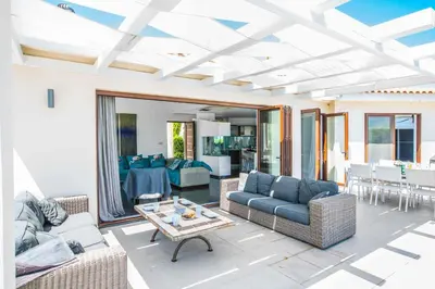 a living room with couches and a table at Villa Nyx in Protaras