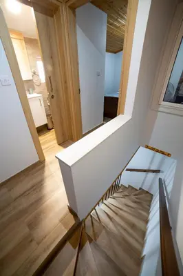 a stairwell in a house with a white stair case at Archontiko Adamou in Kyperounda