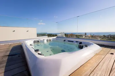 a bath tub on the roof of a house at Napa Hills Seaview Villas - Iris in Ayia Napa