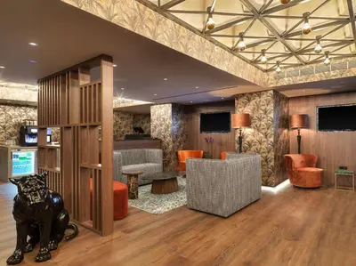 a lobby with a lion statue in the middle of a room at NYX Hotel Limassol in Limassol