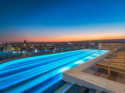 a large swimming pool on top of a building at NYX Hotel Limassol in Limassol