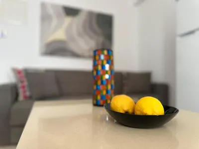 a bowl of lemons sitting on a table at Harbour Seaside Escape in Ayia Napa