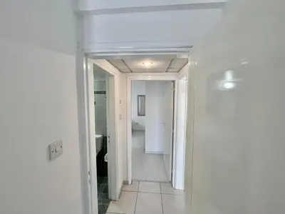 a hallway leading to a bathroom in a house at Two Bedroom City Seaside Apartment in Limassol