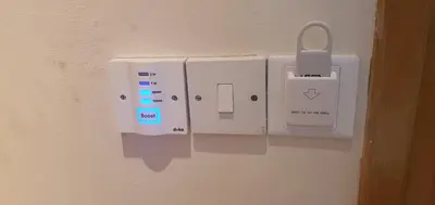 a white electrical outlet on a wall at STEFARIS PROPERTIES 