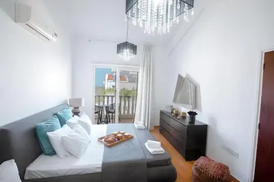 a living room with a couch and a table at Blue Crystal Seaview in Protaras