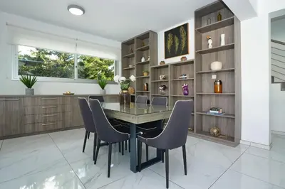 a dining room with a table and chairs at Villa Catalina in Ayia Napa