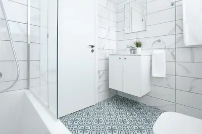 a white bathroom with a sink and a shower at Villa Catalina in Ayia Napa