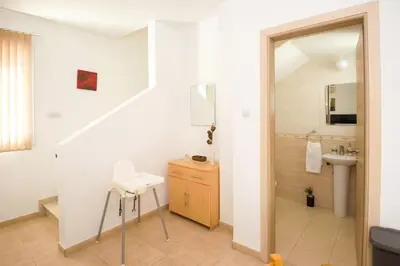 a bathroom with a sink and a toilet and a mirror at Villa Mandy in Protaras