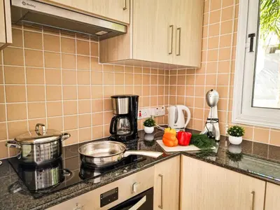 a kitchen with a sink and a counter top at Nissi beach villa Magnolia in Ayia Napa