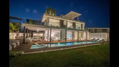 a large house with a swimming pool in front of it at Protaras Olivine Villa Ol3 in Protaras