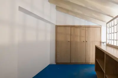 a room with a closet and a blue floor at Protaras Artisan Seafront Villa 7 in Protaras