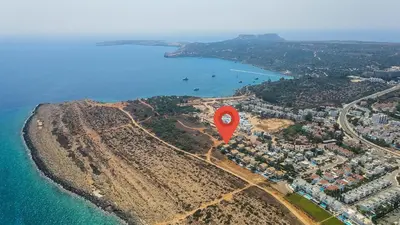 a red balloon is flying over the ocean at Protaras Artisan Seafront Villa 7 in Protaras