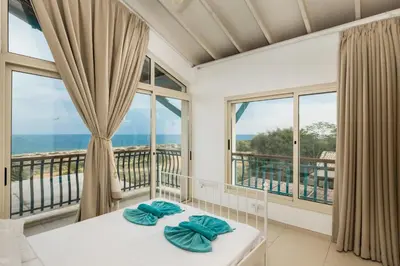 a room with a view of the ocean at Protaras Artisan Seafront Villa 7 in Protaras