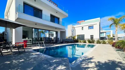 a villa with a swimming pool and a house at By the Bay Villa,3 BR/pool in Protaras