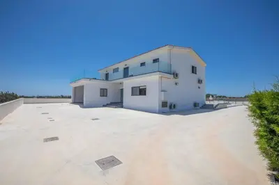 a large white house with a large driveway at Villa Demeter GA98 in Paralimni