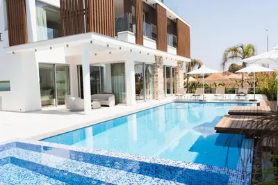 a swimming pool in front of a villa at Seaview Luxury Villa Fortuna in Ayia Napa