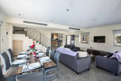 a living room with a table and a couch at Protaras Holiday Villa Dv1 in Protaras