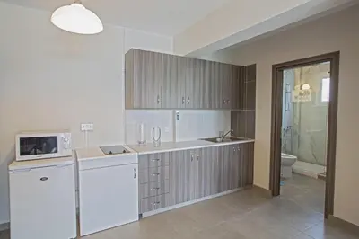 a kitchen with a sink and a microwave at Ayia Napa Holiday Apartment So2 in Ayia Napa