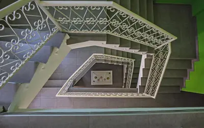 a spiral staircase in a building with purple stairs at Ayia Napa Holiday Apartment So3 in Ayia Napa