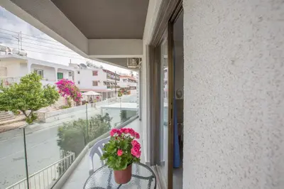 a balcony with a potted plant on a table at Ayia Napa Holiday Apartment So9 in Ayia Napa