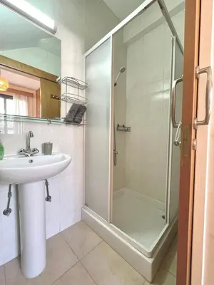 a bathroom with a shower and a sink at Pervolina countryside by the sea in Pervolia