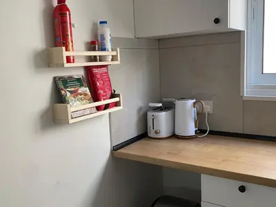 a small kitchen with a counter with some food on it at Peaceful 2 bedroom Flat in Engomi