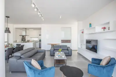 a living room with a couch and chairs and a table at Protaras Olivine Villa Ol5 in Protaras
