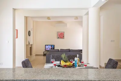 a table with fruit on it in a living room at Protaras Delfini Villa Dv8 in Protaras