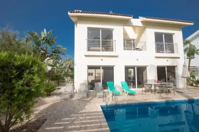 a villa with a swimming pool and a house at Protaras Delfini Villa Dv5 in Protaras