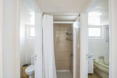 a bathroom with a shower and a toilet and a sink at Villa Delfini 16 in Protaras