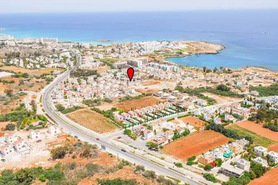 an overhead view of a city with a road and a red sign at Villa Mesogeios ME25 in Protaras