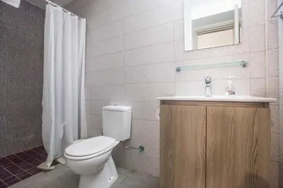 a bathroom with a toilet and a sink at Villa Polymnia Protaras 1 in Protaras