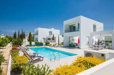 a large white house with a swimming pool at Protaras Greco Villa CCV2 in Protaras